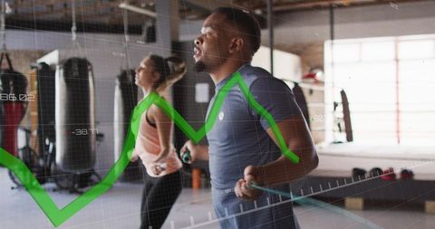 Skipping duo training with jump ropes in warehouse gym with performance graph overlay