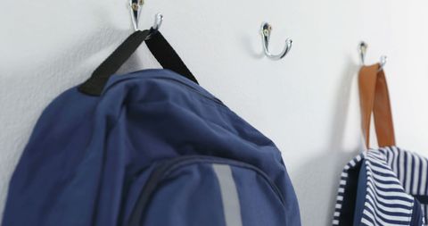 Organized Backpacks on Wall Hooks in Home or School - Download Free Stock Images Pikwizard.com