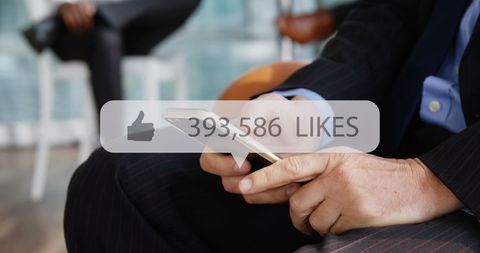 Businessman Analyzing Social Media Engagement on Smartphone - Download Free Stock Images Pikwizard.com
