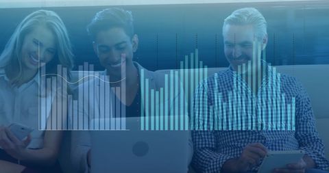 Multicultural Team Analyzing Financial Data on Laptop in Office