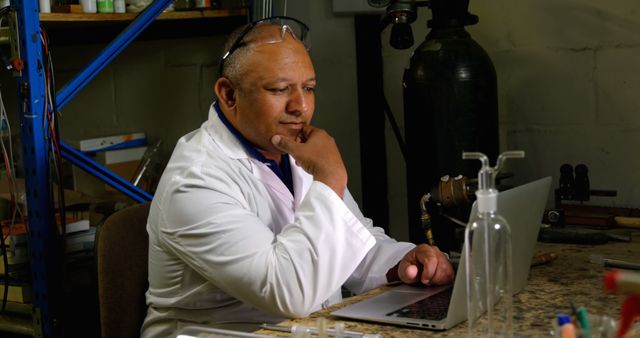 Middle Aged Male Scientist in Laboratory Reviewing Data on Laptop - Download Free Stock Images Pikwizard.com