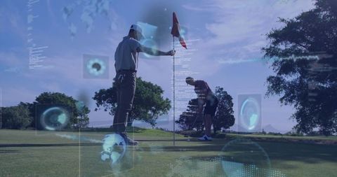 Golfers Using Technology Analytics on Putting Green Outdoors
