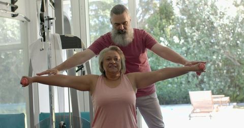 Senior Couple Engaged in Home Gym Exercise