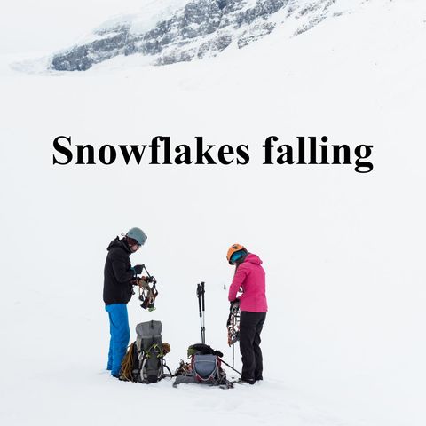 Couple preparing for winter trekking in snowy mountains