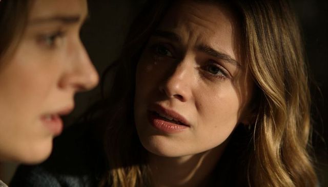 Pleading tearful woman consoling friend in intimate closeup, emotional conversation at home