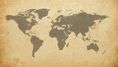 Stylized dotted world map on aged parchment background
