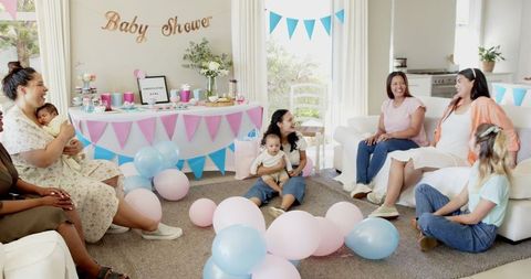 Happy Women Celebrating at Relaxed Baby Shower Gathering