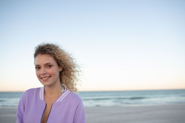 Portrait of beautiful woman standing on the beach