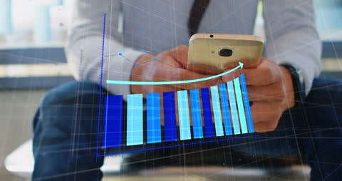 Businessman Examining Financial Graph on Smartphone