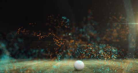 Vibrant Particles Float Over Football on Pitch at Night - Download Free Stock Images Pikwizard.com