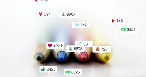 Colored pencil tips showing social media notifications conveying creativity, engagement