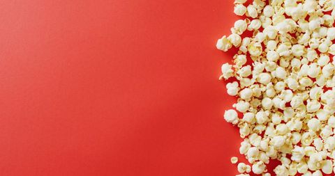 Popcorn on Vibrant Red Background with Copy Space - Download Free Stock Images Pikwizard.com
