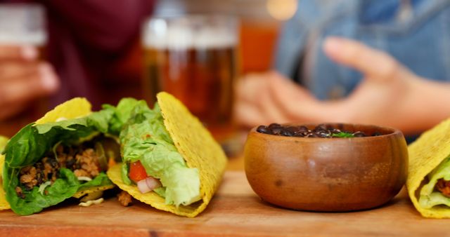 Close-up of Fresh Tacos and Black Beans in Bowl - Download Free Stock Images Pikwizard.com