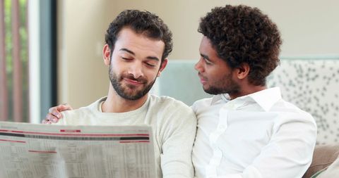 Multicultural Friends Reading Newspaper Together in Relaxed Setting - Download Free Stock Images Pikwizard.com