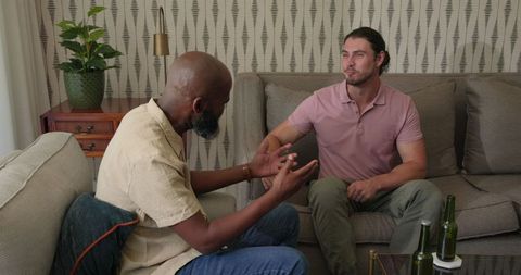 Friends conversing indoors relaxed atmosphere