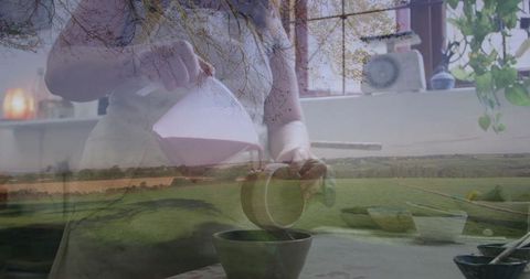 Artisan potter in studio with serene landscape overlay, crafting in harmony