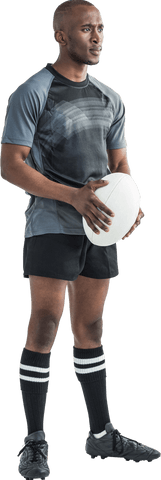 Confident rugby player holding ball on transparent background
