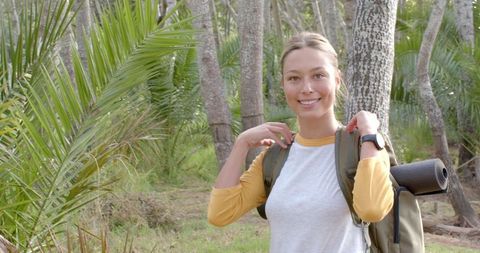 Young Woman Enjoying Nature in Summer Forest Trail
