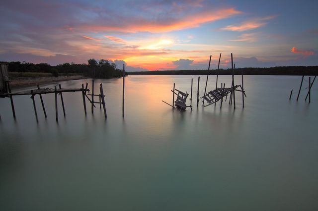 Serene Sunrise Over Tranquil Lake with Wooden Pier - Download Free Stock Photos Pikwizard.com