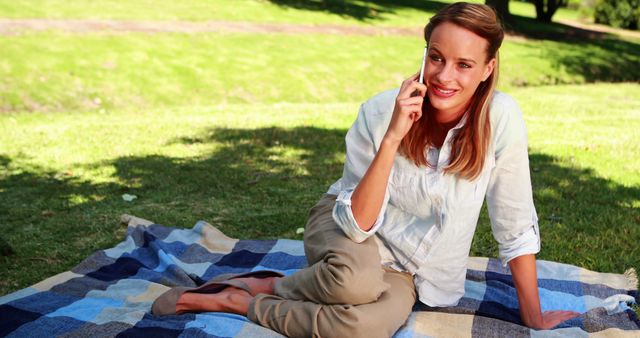 Woman Relaxing in Park while Talking on Smartphone - Download Free Stock Images Pikwizard.com