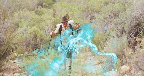Solo hiker trekking rocky sagebrush hillside with mystical blue energy swirl overlay