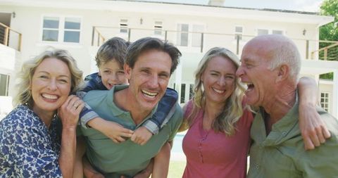 Happy Family Gathered Outdoors Enjoying Beautiful Day