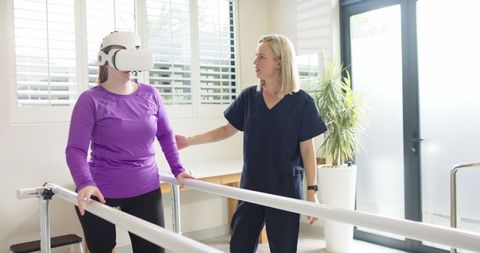 Woman with Prosthetic Leg Rehabilitating Using VR Guided by Therapist - Download Free Stock Images Pikwizard.com