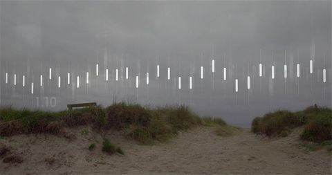 Leading sandy path guiding to coastal horizon with weathered bench and graphic light overlay