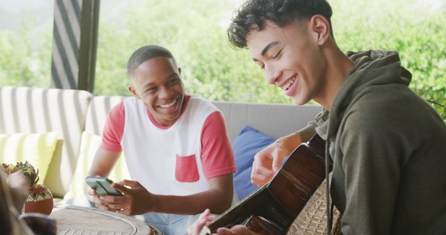 Teenage Friends Enjoying Music Outdoors on a Sunny Day - Download Free Stock Images Pikwizard.com