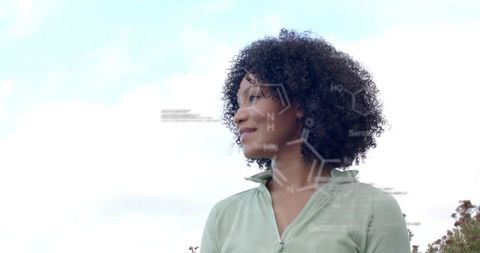 Contemplative woman gazing at sky with molecular diagrams overlay for science inspiration