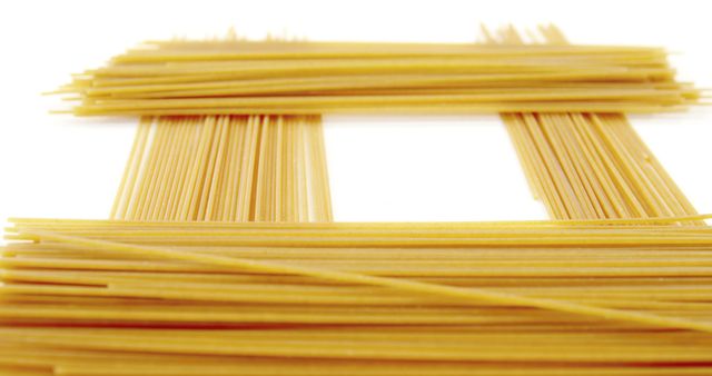 Uncooked Spaghetti Neatly Arranged Isolated on White Background - Download Free Stock Images Pikwizard.com