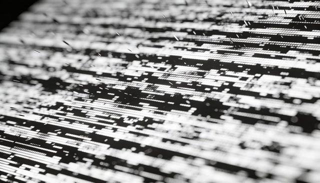 Tilted led matrix display showing high-contrast glitch streaks and illuminated pixel clusters