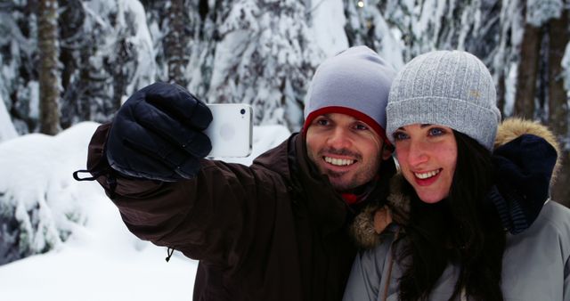 Couple Taking Selfie in Snowy Winter Forest - Download Free Stock Images Pikwizard.com