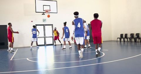 African American Youth Basketball Game in Indoor Gym