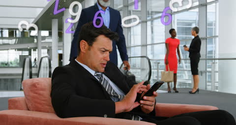 Businessman Analyzing Smartphone Data with Virtual Interface Overlay