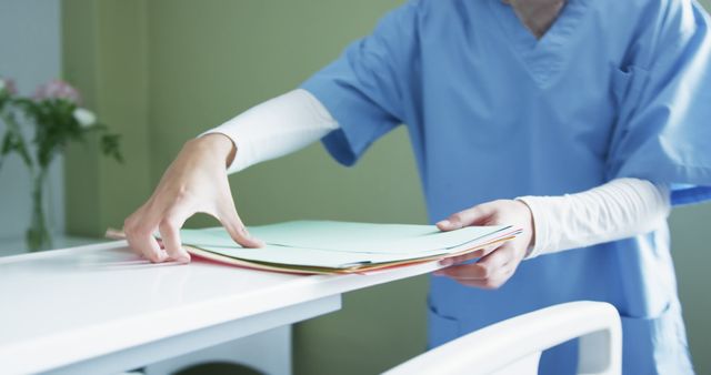 Nurse Organizing Medical Records At Desk - Download Free Stock Images Pikwizard.com