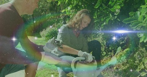 Couple Enjoying Backyard Gardening with Cosmic Touch