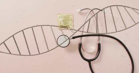 DNA Specimen Concept with Stethoscope and Condom on Pink Background - Download Free Stock Images Pikwizard.com