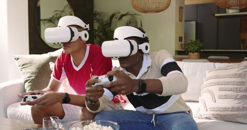 Friends Gaming with VR Headsets and Controllers in Living Room