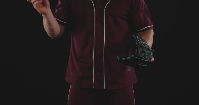 Athlete in Burgundy Baseball Uniform Holding Baseball Glove - Download Free Stock Images Pikwizard.com