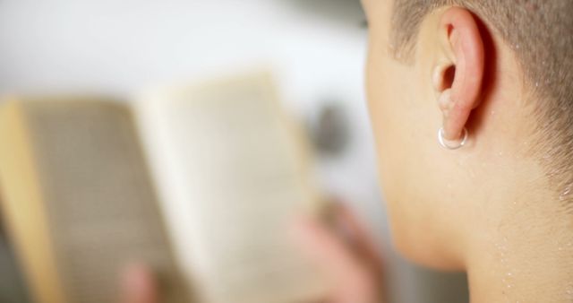 Teenager Reading Paperback Book Up Close - Download Free Stock Images Pikwizard.com