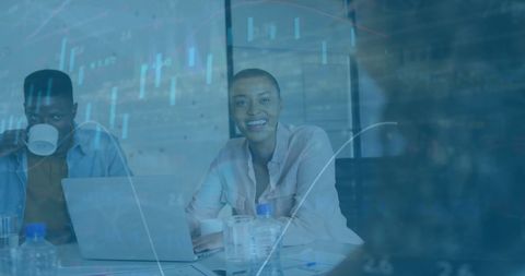 Team Collaborating on Financial Data Analysis in Office