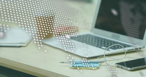 Minimal workspace with laptop, smartphone, pen and dotted world map overlay