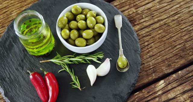 Mediterranean Green Olives with Herbs, Garlic, Olive Oil, and Red Chili Peppers - Download Free Stock Images Pikwizard.com