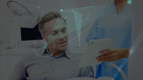 Dentist Discussing Treatment Plan Using Digital Tablet