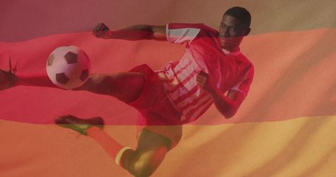 Exciting image showing a football player energetically kicking football, overlayed with colorful Germany flag. Reflects themes of sportsmanship and competitive spirit, capturing essence of football culture intertwined with nationalist pride. Useful for materials focusing on European sports events or promotional content connecting sporting events with German cultural influence.