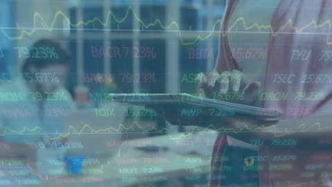 Businesswoman Analyzing Financial Data with Tablet in Office