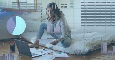 Focused Businesswoman Analyzing Financial Trends on Laptop