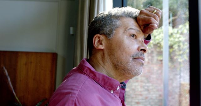 Thoughtful Senior Man Looking out Window Reflective Mood - Download Free Stock Images Pikwizard.com