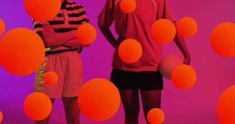 Dynamic Female Athletes with Volleyball in Vibrant Studio